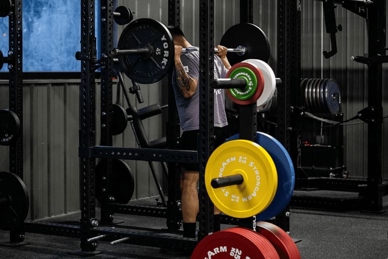 Cardio machines along the wall at Strong Barbell Club Manhattan